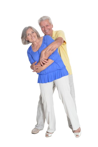 Senior couple hugging isolated on white background full length