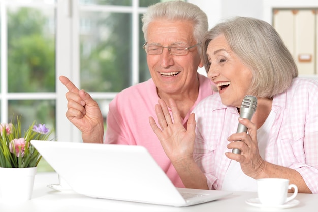 Senior couple husband and wife singing songs