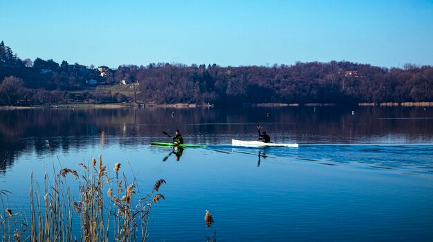 Senior couple kayaking in a lake, ITALY