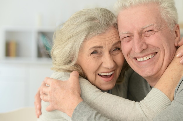 Senior couple laughing at home