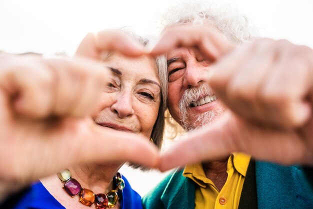 Senior couple of old people dating outdoors