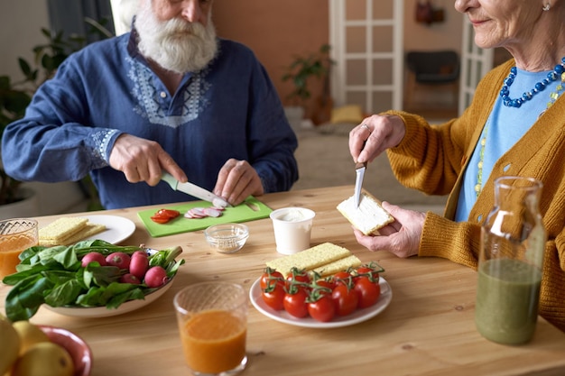 Senior couple preparing breakfast together