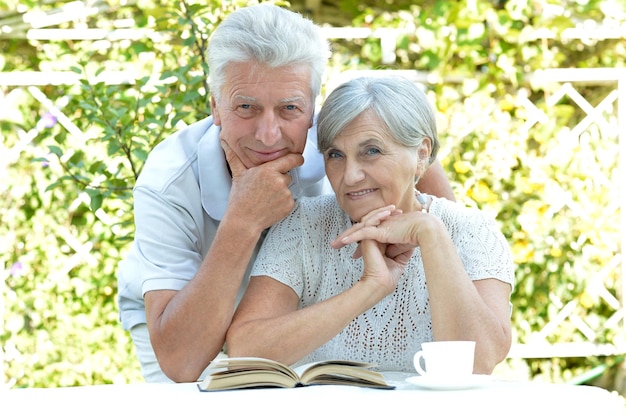 Senior couple reading a book