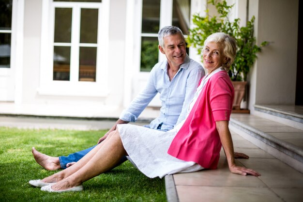 Senior couple relaxing on steps