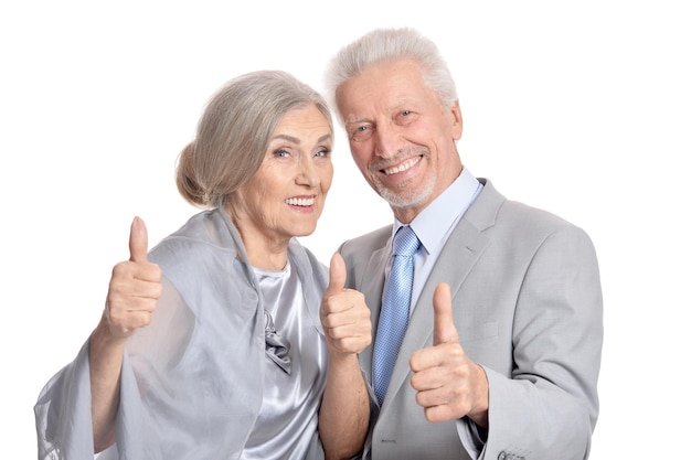 Senior couple showing thumbs up