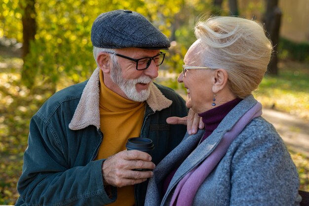 Senior couple sitting and drinking hot coffee