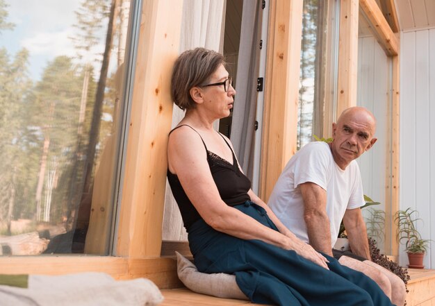 Senior couple sitting on terrace at summer