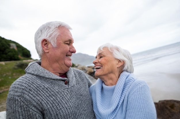 Senior couple standing together on the beach