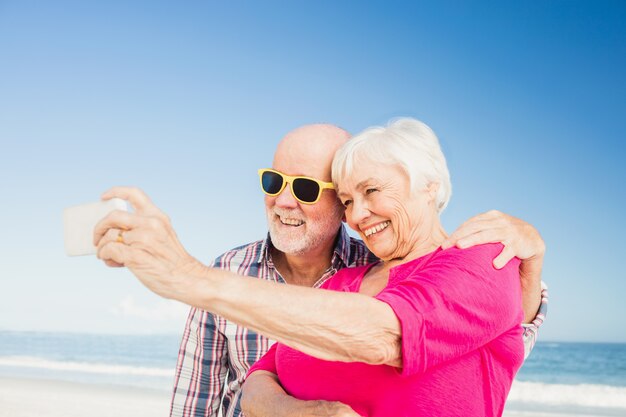 Senior couple taking selfie