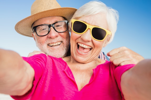 Senior couple taking selfie