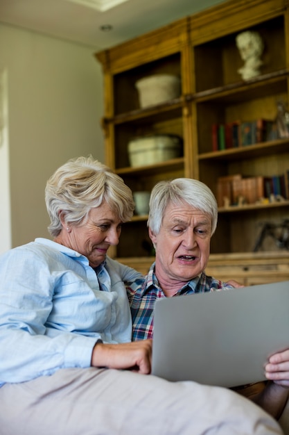 Senior couple using digital tablet