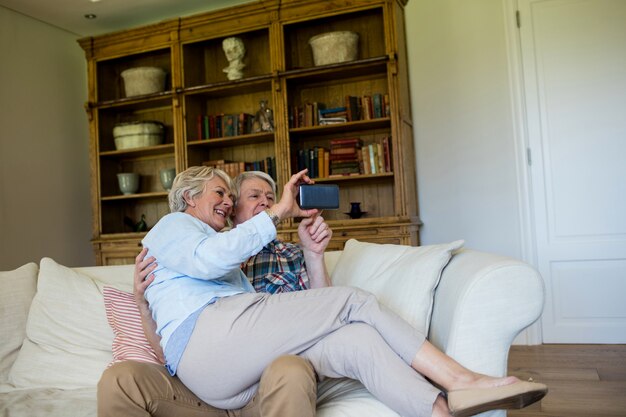 Senior couple using mobile phone