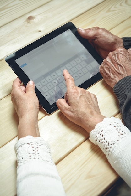 Senior couple using a tablet at home