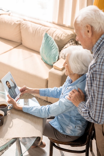 Senior Couple Using Video Chat to Talk to Family