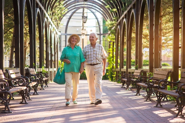 Senior couple walking and smiling