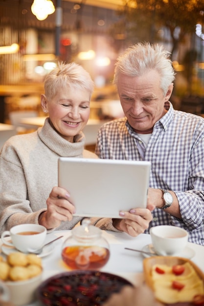 Senior couple watching movie online