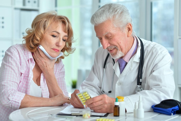 Senior doctor with elderly patient