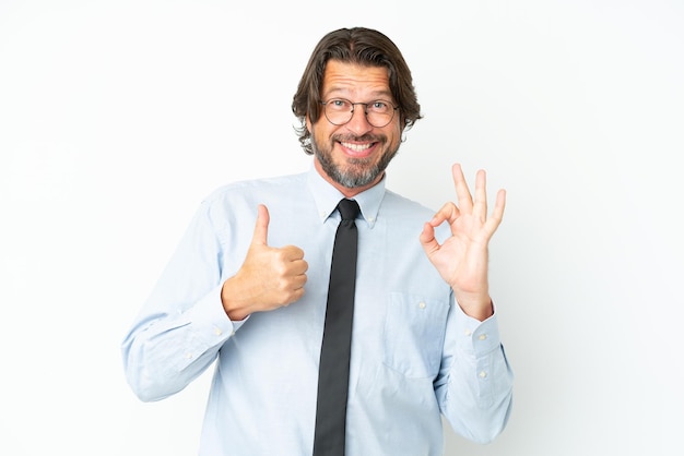 Senior dutch business man isolated on white background showing ok sign and thumb up gesture