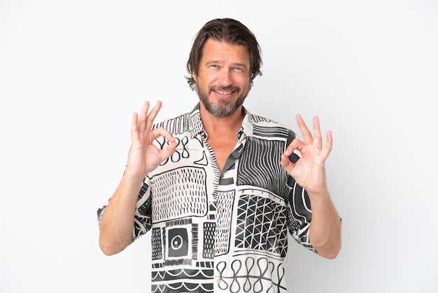 Senior dutch man isolated on white background showing ok sign with two hands