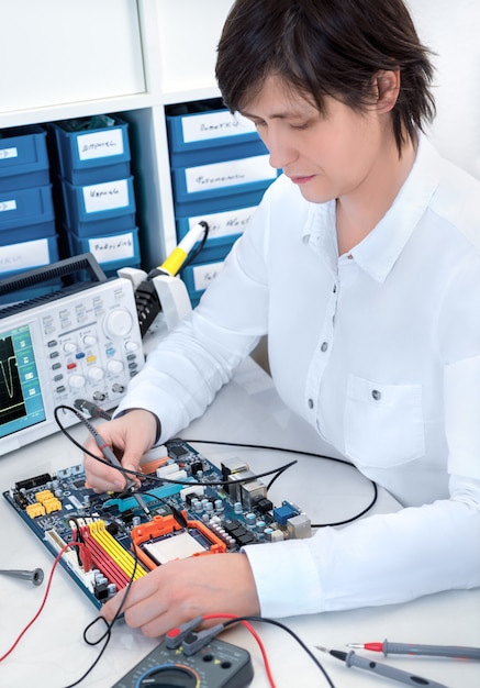 Senior electronics repairman working