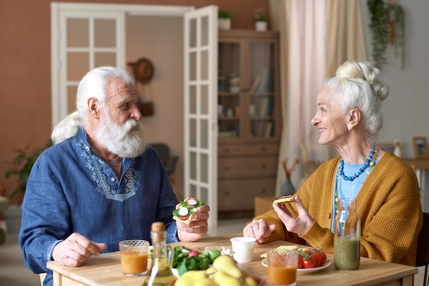 Senior family talking to each other at lucnh