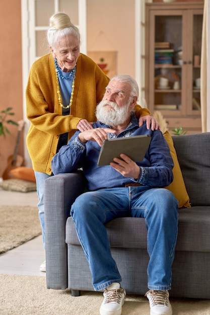 Senior family using tablet pc at home