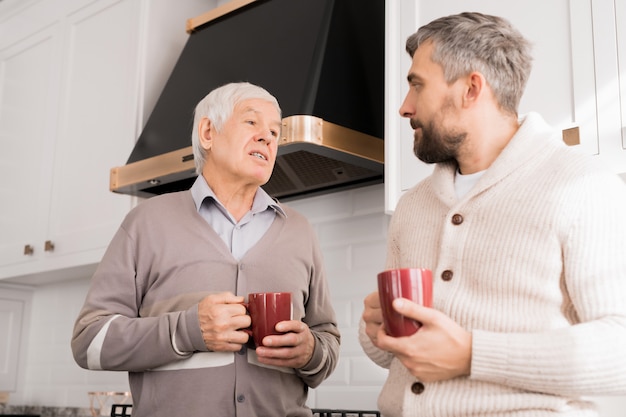 Senior Father Talking to Adult Son