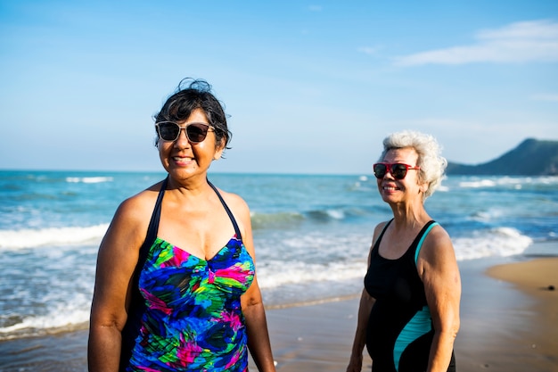 Senior friends chilling on the beach