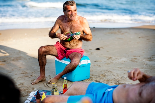 Senior friends hanging out on the beach