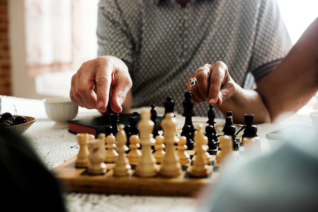 Senior friends playing chess together