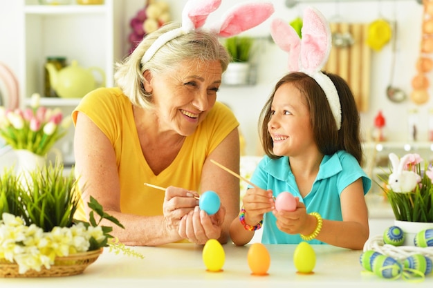 Senior grandmother and granddaughter with Easter eggs