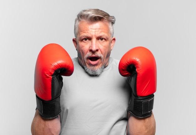 senior handsome man boxing