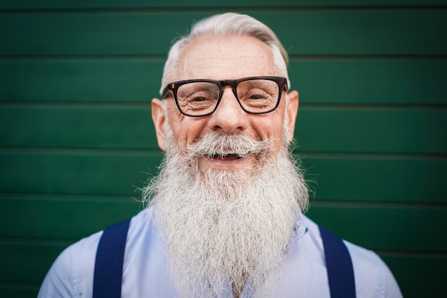 Senior hipster man smiling