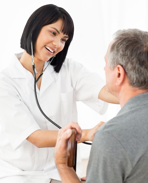 Senior laughing with his nurse