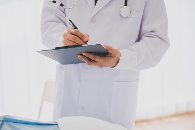 Senior male retirement patient receive medical treatment record by physician at the hospital for medical healthcare service