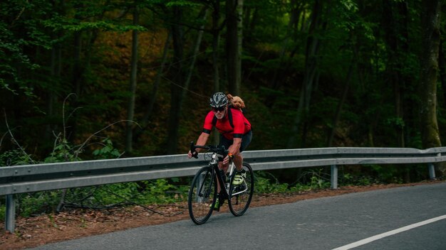 Senior man cycling with his puppy