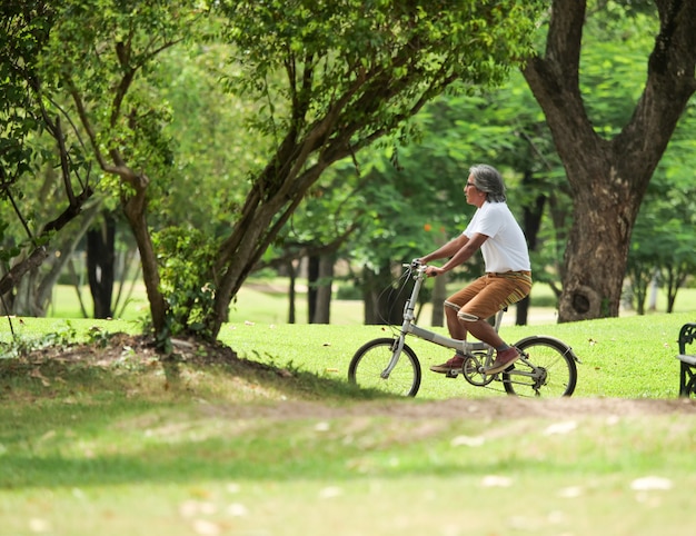 Senior man cyling in Park