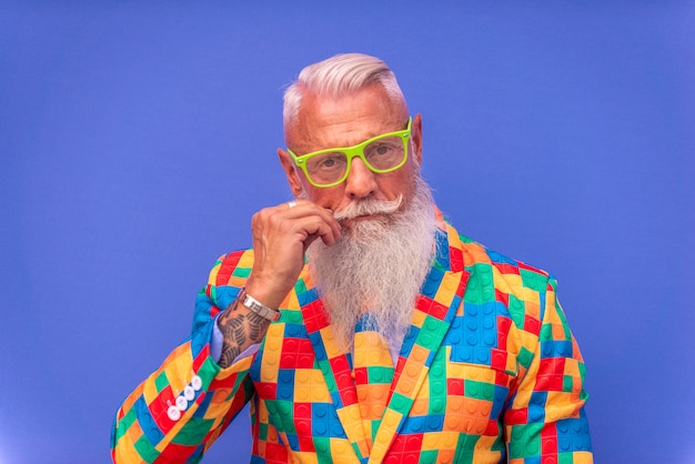 senior man in extravagant colorful clothes