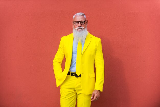 senior man in extravagant yellow suit