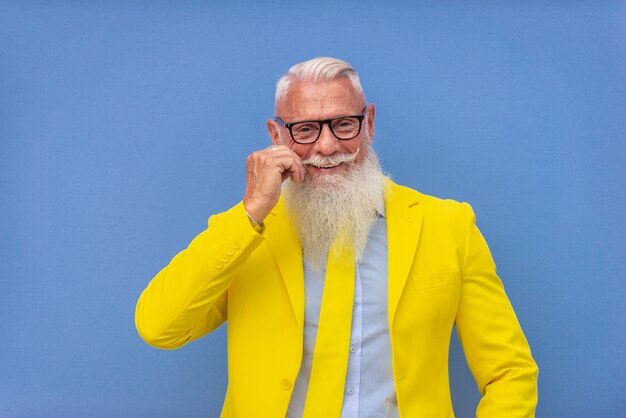 senior man in extravagant yellow suit