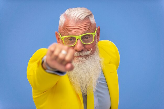 senior man in extravagant yellow suit