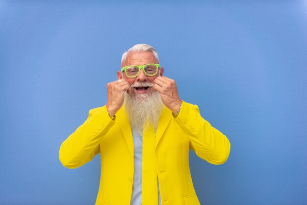 senior man in extravagant yellow suit