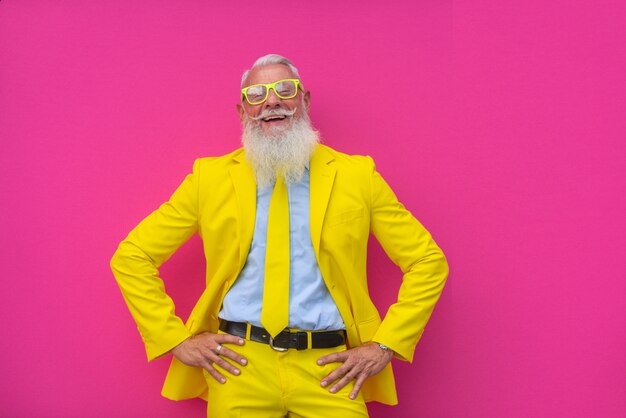 senior man in extravagant yellow suit