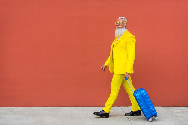 senior man in extravagant yellow suit