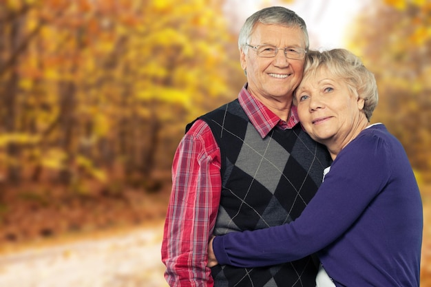 Senior man giving woman piggyback ride