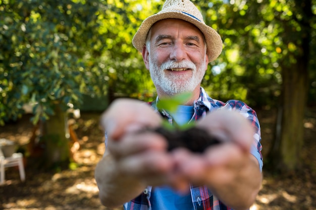 Senior man holding crop in his hands