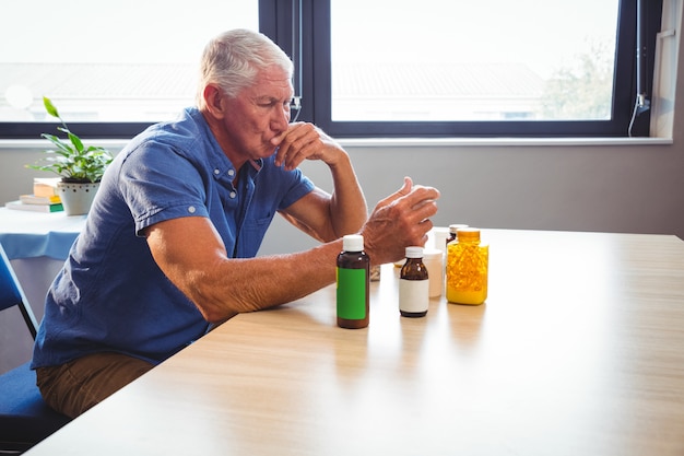 Senior man holding medicine