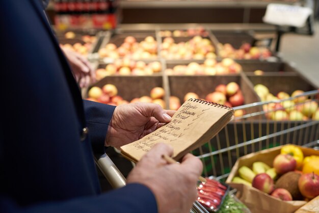 Senior Man Holding Shopping List