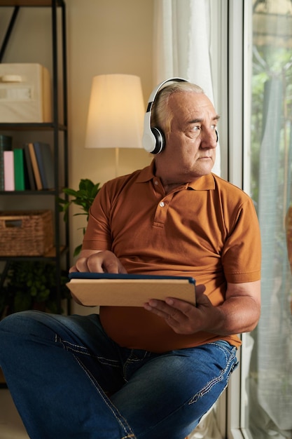 Senior Man Listening to Radio