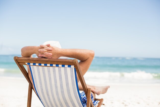 Senior man lying in a sunchair